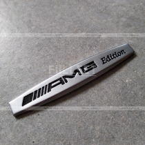 Эмблема AMG стальная матовая серебро (размер: 10 см на 2 см)