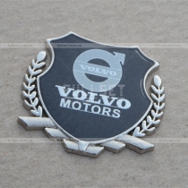 Эмблема герб Volvo на карбоновом фоне