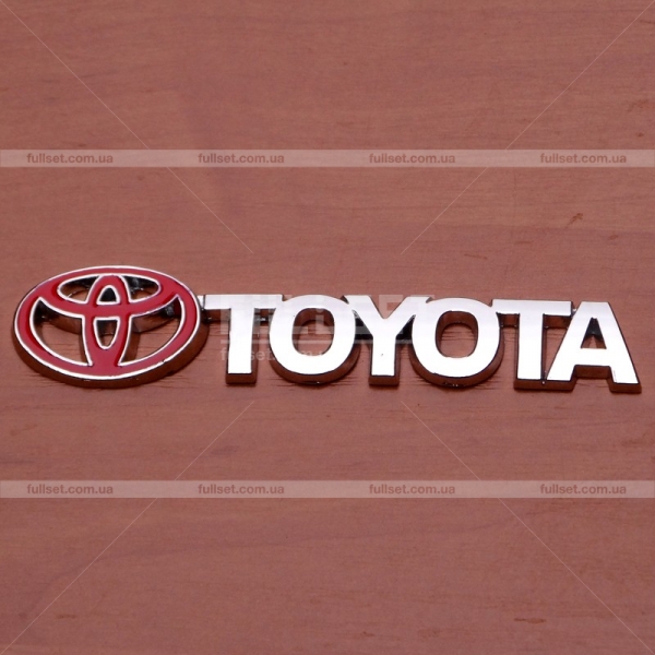 Эмблема с надписью Тойота